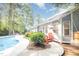 Beautiful backyard with a swimming pool, lush greenery, and a charming home exterior, perfect for outdoor enjoyment at 302 Caraway Ln, Cary, NC 27519