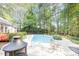 Lovely backyard with a swimming pool, comfortable seating, and lush landscaping, creating an ideal outdoor oasis at 302 Caraway Ln, Cary, NC 27519