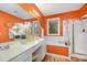 Bright bathroom with a large mirror, double sinks, soaking tub, walk-in shower, and stylish fixtures at 302 Caraway Ln, Cary, NC 27519