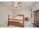 Comfortable bedroom with a wooden bed frame, side tables with lamps, and a window at 302 Caraway Ln, Cary, NC 27519