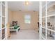 Inviting bedroom with natural light and neutral colors, viewed through glass panel French doors at 302 Caraway Ln, Cary, NC 27519