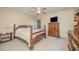 Cozy bedroom featuring a wooden bed frame, side tables with lamps, and a window for natural light at 302 Caraway Ln, Cary, NC 27519