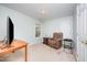 Comfortable bedroom includes a recliner, television, and bedside table offering a relaxing retreat at 302 Caraway Ln, Cary, NC 27519