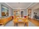 Spacious dining room with a large table, wooden chairs, and a display cabinet at 302 Caraway Ln, Cary, NC 27519