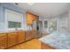 Bright kitchen featuring stainless steel appliances, wood cabinets, granite countertops, and breakfast nook at 302 Caraway Ln, Cary, NC 27519