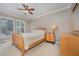 Cozy main bedroom features a ceiling fan and lots of natural light at 302 Caraway Ln, Cary, NC 27519