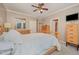 Spacious main bedroom features natural light, a ceiling fan, and lots of space at 302 Caraway Ln, Cary, NC 27519