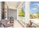 Inviting front porch with wicker chairs and potted plants, perfect for relaxing outdoors at 302 Caraway Ln, Cary, NC 27519