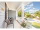 Inviting front porch with wicker chairs and potted plants, perfect for relaxing outdoors at 302 Caraway Ln, Cary, NC 27519