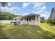 Backyard with a patio, grill, green grass, landscaping and neutral siding at 3037 Willow Ranch Dr, Fuquay Varina, NC 27526