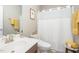 Clean bathroom featuring a vanity, toilet, and shower with white curtain at 3037 Willow Ranch Dr, Fuquay Varina, NC 27526