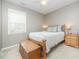 Cozy bedroom with neutral paint, ceiling fan and a soft, inviting bed at 3037 Willow Ranch Dr, Fuquay Varina, NC 27526