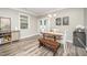 Bright dining area with wood flooring, stylish furniture, and a window offering natural light at 3037 Willow Ranch Dr, Fuquay Varina, NC 27526