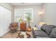 Inviting living room with wood floors, natural light, and cozy seating at 3037 Willow Ranch Dr, Fuquay Varina, NC 27526
