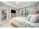 Spacious main bedroom with a tray ceiling, fan, carpet, and an attached ensuite at 3037 Willow Ranch Dr, Fuquay Varina, NC 27526