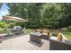 Enjoy the patio with an outdoor dining area and fire pit for cozy evenings at 3037 Willow Ranch Dr, Fuquay Varina, NC 27526