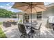 Relax on the patio featuring an outdoor dining area and comfortable seating by the home at 3037 Willow Ranch Dr, Fuquay Varina, NC 27526