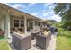 The patio has a seating area with a fire pit, outdoor dining and landscaped yard at 3037 Willow Ranch Dr, Fuquay Varina, NC 27526