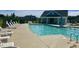 Community pool with lounge chairs and an open-air structure for shade, offering a refreshing amenity for residents at 3037 Willow Ranch Dr, Fuquay Varina, NC 27526