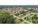 Beautiful aerial view of a quiet residential community featuring a scenic pond and lush greenery at 304 Quailwood Dr, Fuquay Varina, NC 27526