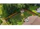 Large, fully fenced backyard with a well-maintained lawn, a shed and a wood deck for outdoor enjoyment at 304 Quailwood Dr, Fuquay Varina, NC 27526