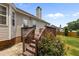 The backyard features a wooden deck and roses at 304 Quailwood Dr, Fuquay Varina, NC 27526