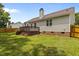 This home features a lush backyard, wooden deck, and brick foundation at 304 Quailwood Dr, Fuquay Varina, NC 27526