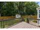 The home features a lush backyard with a wooden deck and shed at 304 Quailwood Dr, Fuquay Varina, NC 27526