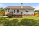 This home features a lush backyard and deck at 304 Quailwood Dr, Fuquay Varina, NC 27526