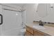Updated bathroom with single granite vanity and tub/shower combo at 304 Quailwood Dr, Fuquay Varina, NC 27526