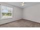 A bedroom with carpet, a ceiling fan, and a window at 304 Quailwood Dr, Fuquay Varina, NC 27526