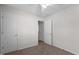 A bedroom with carpet, a ceiling fan and 2 doors at 304 Quailwood Dr, Fuquay Varina, NC 27526