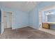 This spacious bedroom features an en-suite bathroom and walk-in closet, with neutral paint and carpet ready for your personal touch at 304 Quailwood Dr, Fuquay Varina, NC 27526