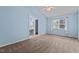 Bedroom with carpet, ceiling fan, and adjoining sink vanity at 304 Quailwood Dr, Fuquay Varina, NC 27526