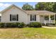 Charming single-story house with a well-manicured lawn and inviting front porch at 304 Quailwood Dr, Fuquay Varina, NC 27526