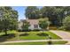 Charming home showcasing a well-manicured lawn, trimmed bushes and an inviting front yard at 304 Quailwood Dr, Fuquay Varina, NC 27526