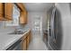Galley kitchen with stainless steel appliances and view to the outside at 304 Quailwood Dr, Fuquay Varina, NC 27526