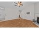 Well-lit living room with fireplace, ready for tv mount, and easy access to other areas at 304 Quailwood Dr, Fuquay Varina, NC 27526