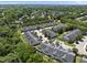 Neighborhood aerial showcasing well-maintained townhomes surrounded by mature trees at 3207 Imperial Oaks Dr, Raleigh, NC 27614