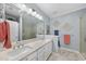 Bright bathroom with double sinks, tile flooring, updated fixtures and glass enclosed shower at 3207 Imperial Oaks Dr, Raleigh, NC 27614