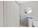 Bathroom featuring a shower with patterned curtain, and a mirrored wall accent at 3207 Imperial Oaks Dr, Raleigh, NC 27614