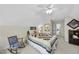 Bedroom with carpet, soft lighting, and a cozy rocking chair with view of hallway at 3207 Imperial Oaks Dr, Raleigh, NC 27614