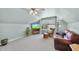 Bright bonus room with a ceiling fan, plush carpet, and a comfortable seating area at 3207 Imperial Oaks Dr, Raleigh, NC 27614