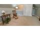 Bonus room with neutral carpet, rocking chair, and built-in closet for extra storage at 3207 Imperial Oaks Dr, Raleigh, NC 27614