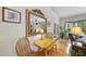 Charming dining area with wood table, chairs, and view into living room at 3207 Imperial Oaks Dr, Raleigh, NC 27614