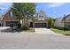Charming home featuring stone accents, a well-manicured lawn, and an attached two-car garage at 3207 Imperial Oaks Dr, Raleigh, NC 27614