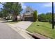 View of the home featuring stone accents, and driveway leading to an attached two-car garage at 3207 Imperial Oaks Dr, Raleigh, NC 27614