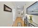 Inviting hallway with hardwood floors, neutral walls, and elegant decor, leading to the main living spaces at 3207 Imperial Oaks Dr, Raleigh, NC 27614