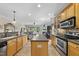 Spacious kitchen with an island, stainless steel appliances, and an open view to the living room at 3207 Imperial Oaks Dr, Raleigh, NC 27614