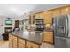 Updated kitchen with stainless steel appliances, spacious island, and wood cabinets at 3207 Imperial Oaks Dr, Raleigh, NC 27614